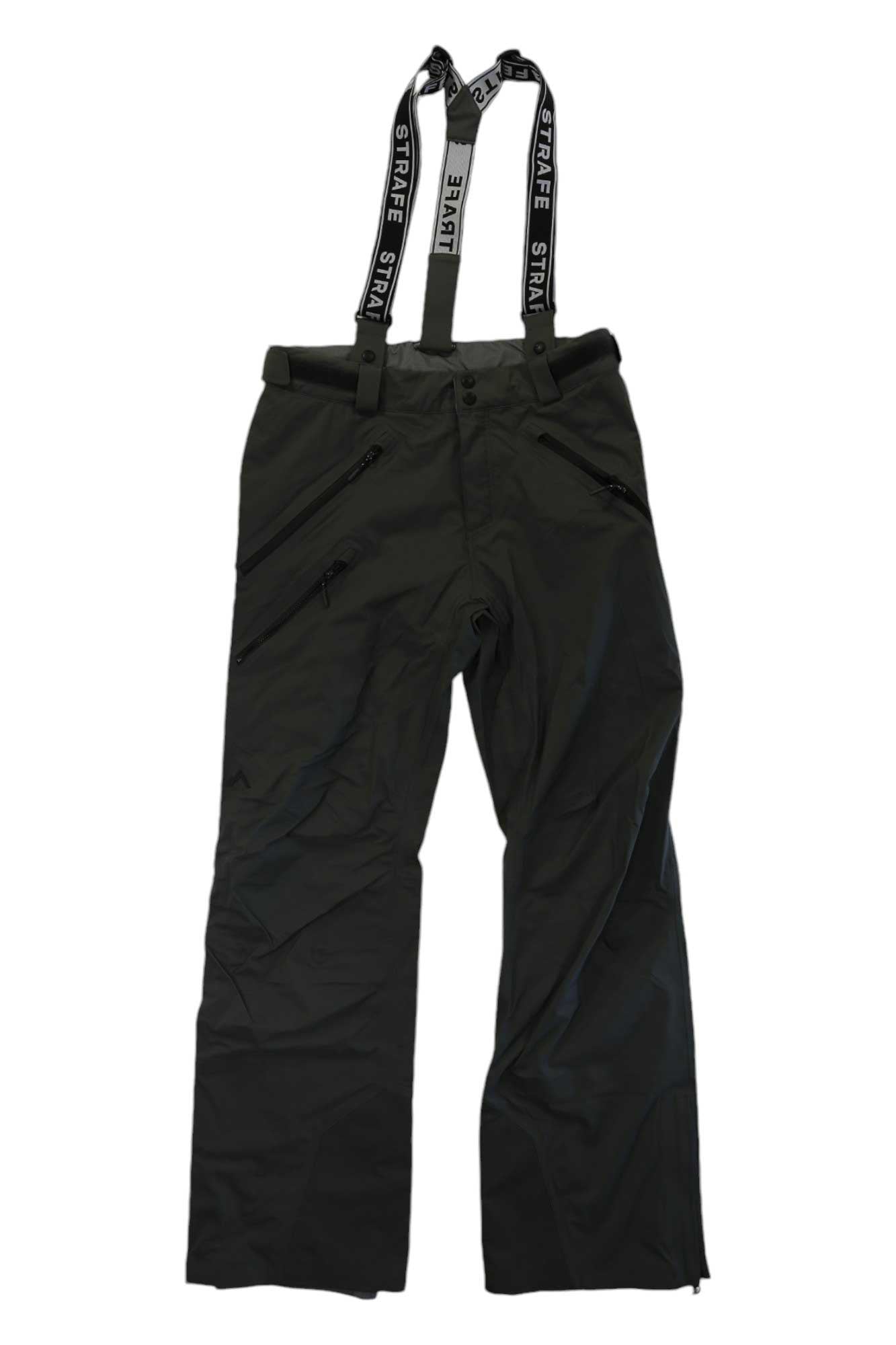 The Strafe Mens Capitol Pant is a black ski pant for men with 4-way stretch, multiple zippered pockets, and adjustable black-and-white STRAFE suspenders at the waist—ideal waterproof pants for comfort, performance, and style.
