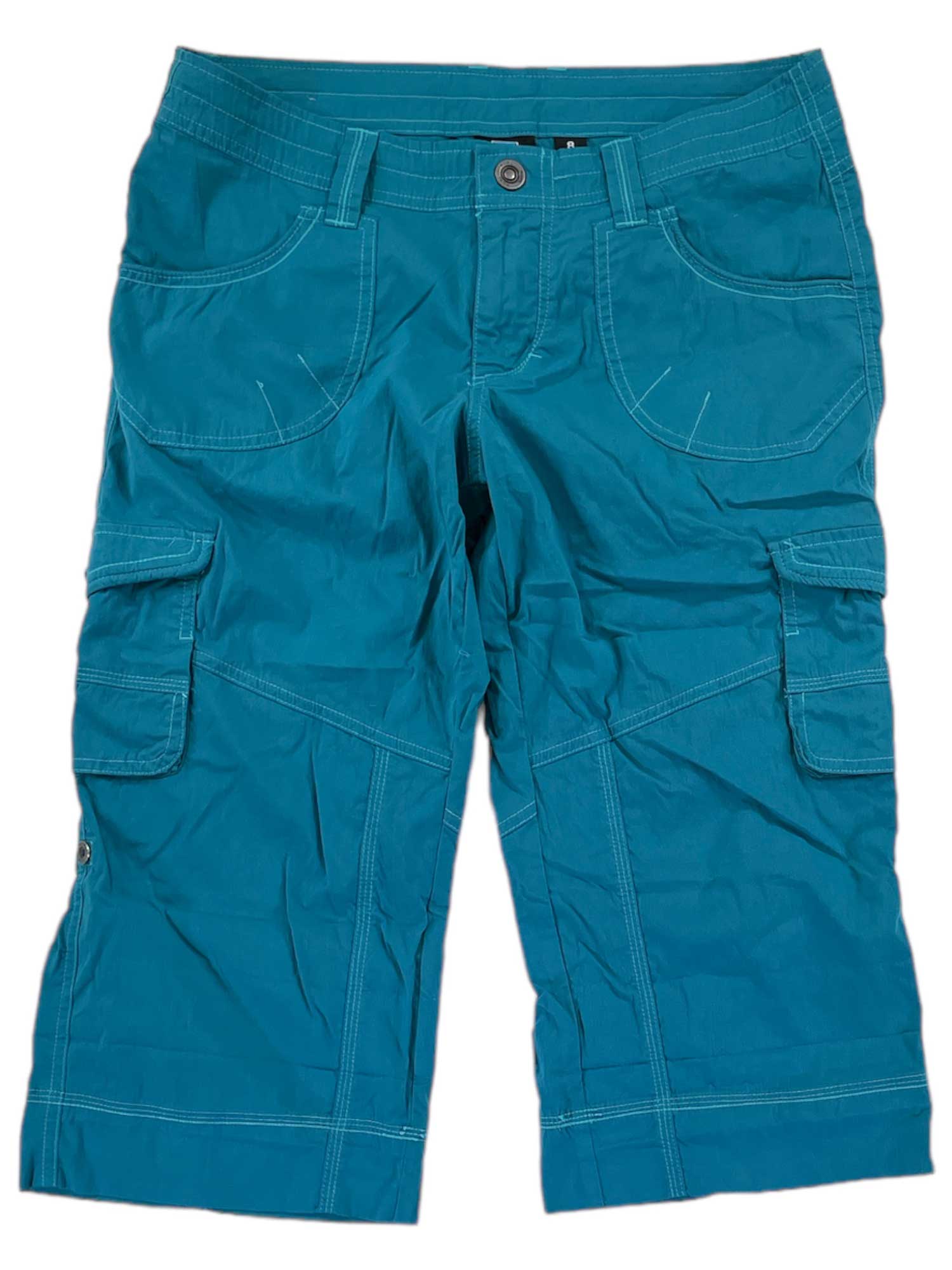 The Womens Kontra Roll Up Short in bright teal features multiple pockets, visible stitching, a button and zipper closure, and knee-length hems—perfect for travel—shown laid flat on a white background.