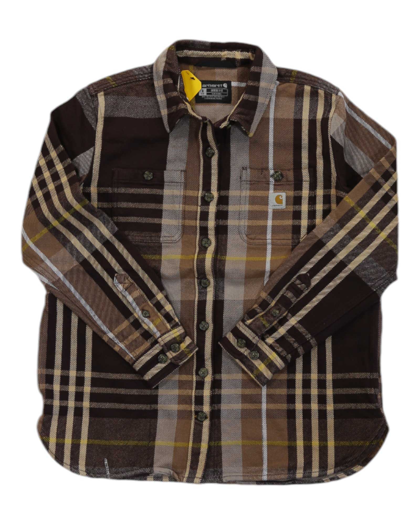 The Carhartt Women's Loose Fit Heavyweight Twill LS Plaid Shirt is a button-up with long sleeves, brown-yellow-beige plaid, two chest pockets, and a small logo tag on the left pocket.