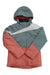 The Spyder Girls Zoey Jacket is an insulated, waterproof ski jacket with a hood, featuring muted green, coral pink color blocks, and a diagonal white stripe on the chest and right sleeve. The jacket is laid flat on a white background.