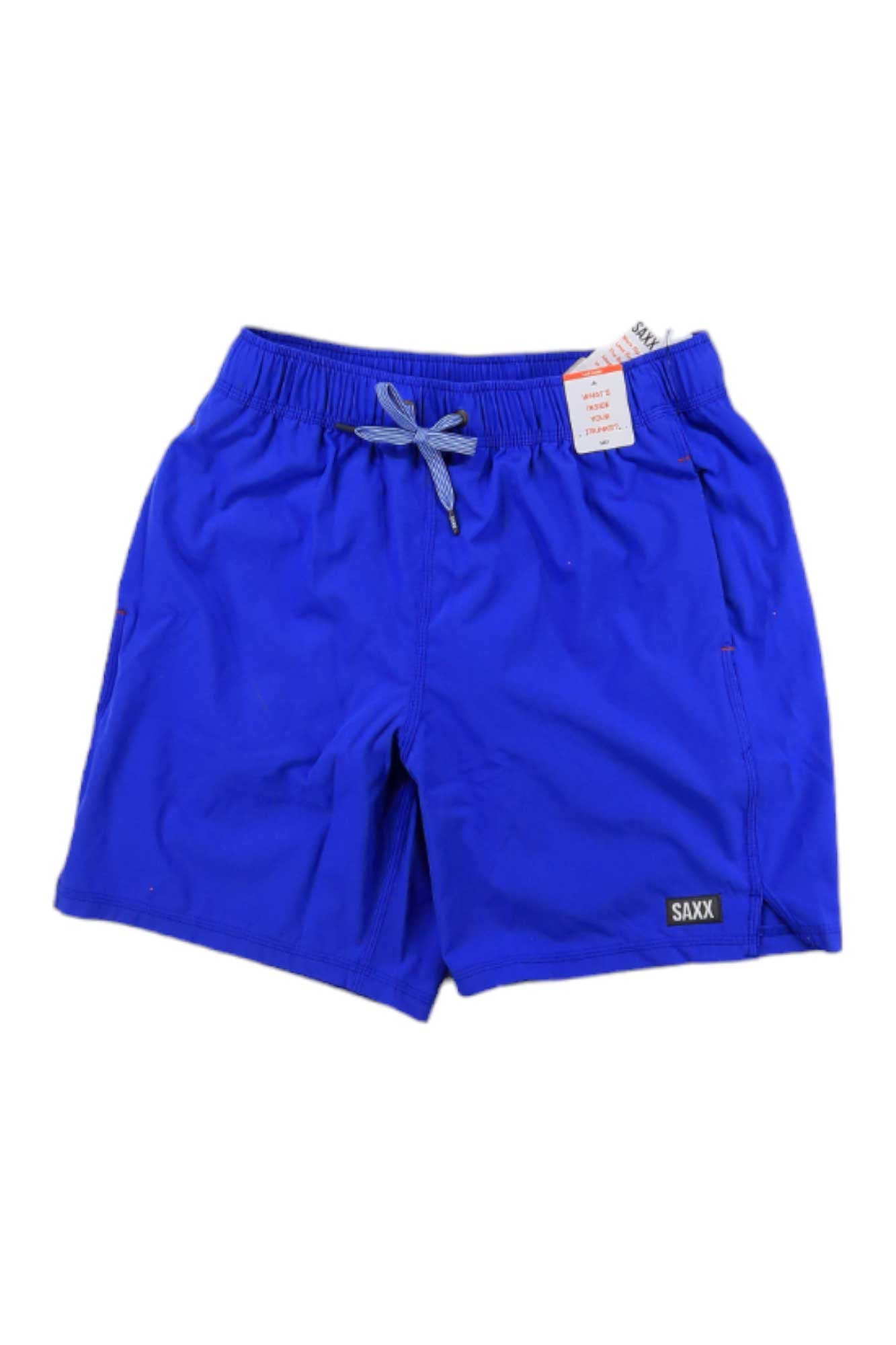 The SAXX Mens Oh Buoy 2 in 1 7 inch Swim Short features a bright blue color, drawstring waistband, front pockets, and a small SAXX logo patch on the left leg. A price tag hangs from the waistband.