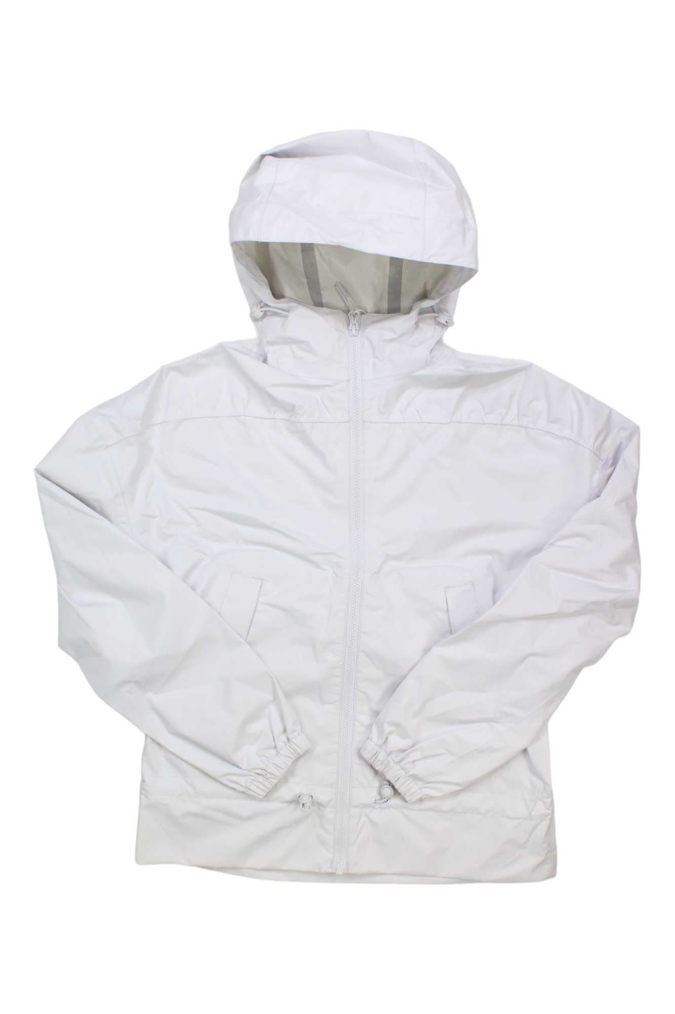 The Helly Hansen Women's Escape Jacket is a plain white jacket with a front zipper, adjustable hood, long sleeves, elastic cuffs, and pockets, shown on a white background.