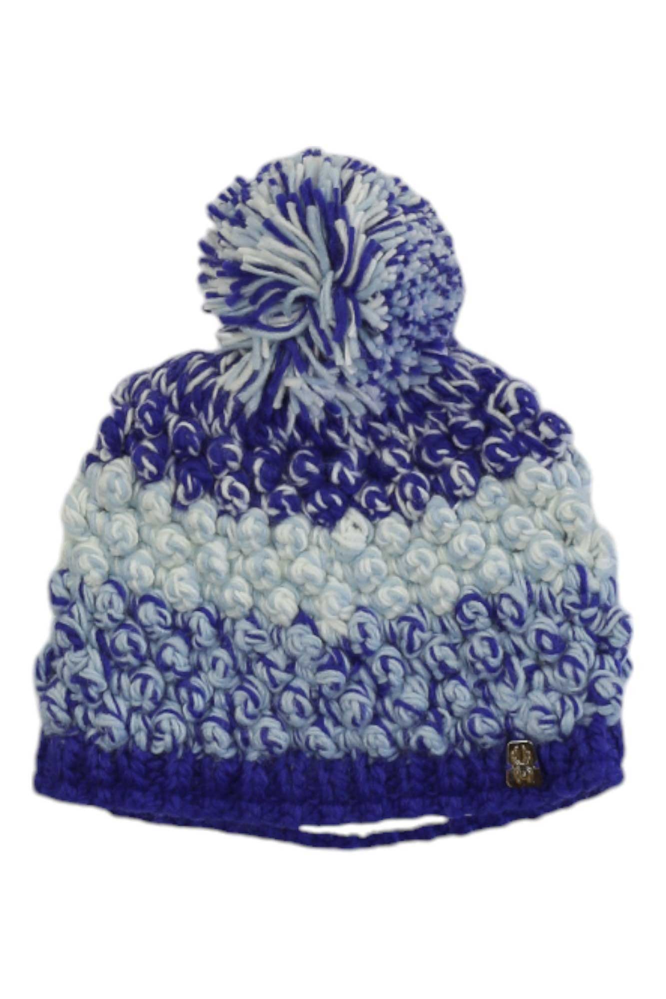 The Spyder Girls Bitsy Brrr Berry Hat is a cozy winter beanie with a large pom-pom, blue and white knit pattern, soft fleece lining, and a small metallic tag near the brim.