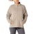 A woman in a light beige Icebreaker Women's Tropos Jacket with a high collar and side pockets stands with hands in the pockets. The relaxed-fit insulated jacket is paired with dark pants; her face is partially out of frame.