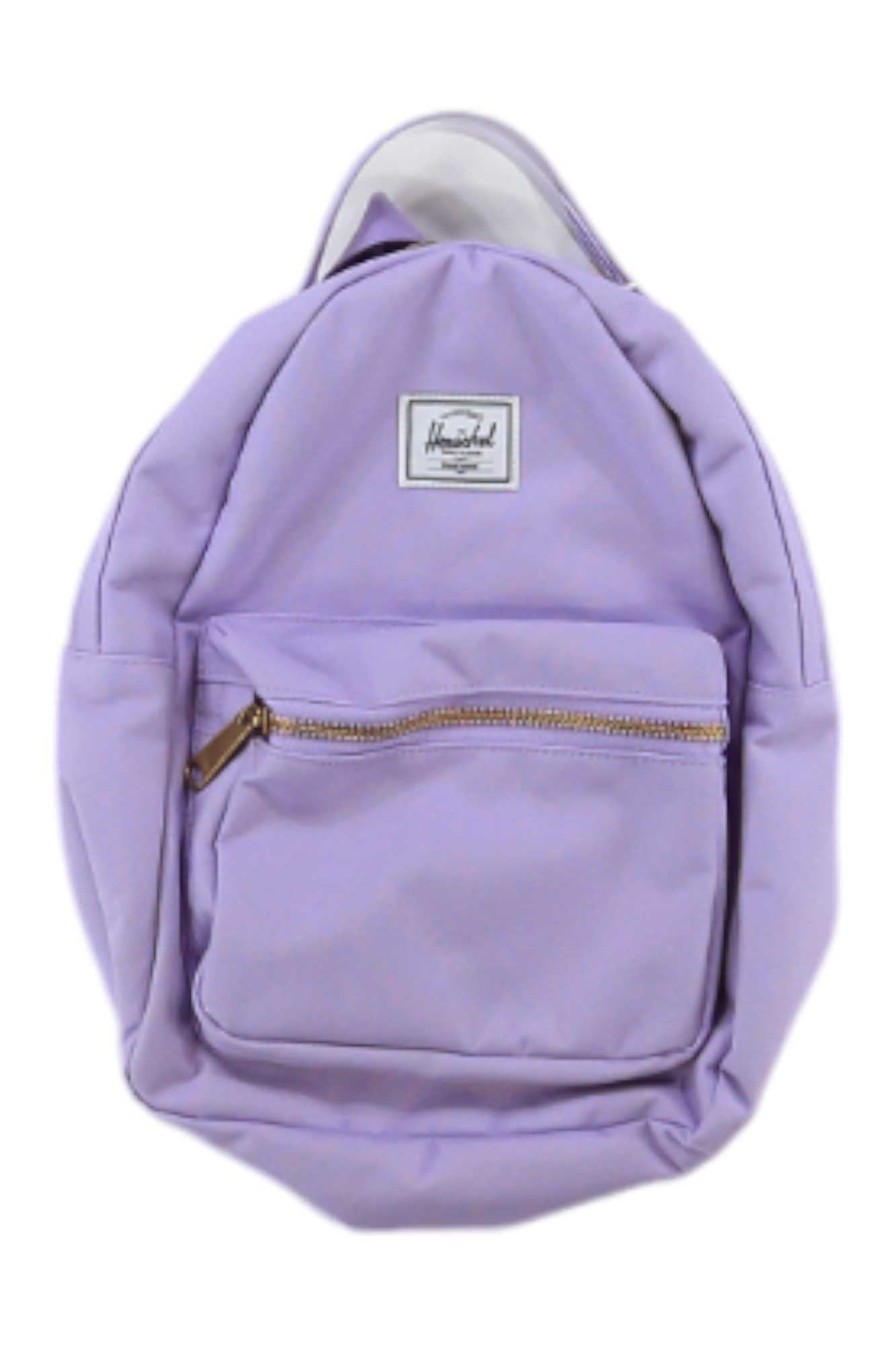 The Herschel Supply Co Nova Mini Backpack is light purple with a front zippered pocket, white upper front label, adjustable shoulder straps, and a top handle, shown against a white background.
