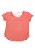 The Craft Sportswear Womens Core Charge Cross Back Tee is a coral pink, short-sleeve, loose-fitting training top with a scoop neckline and crisscross back straps, shown flat on a white background with tags attached.
