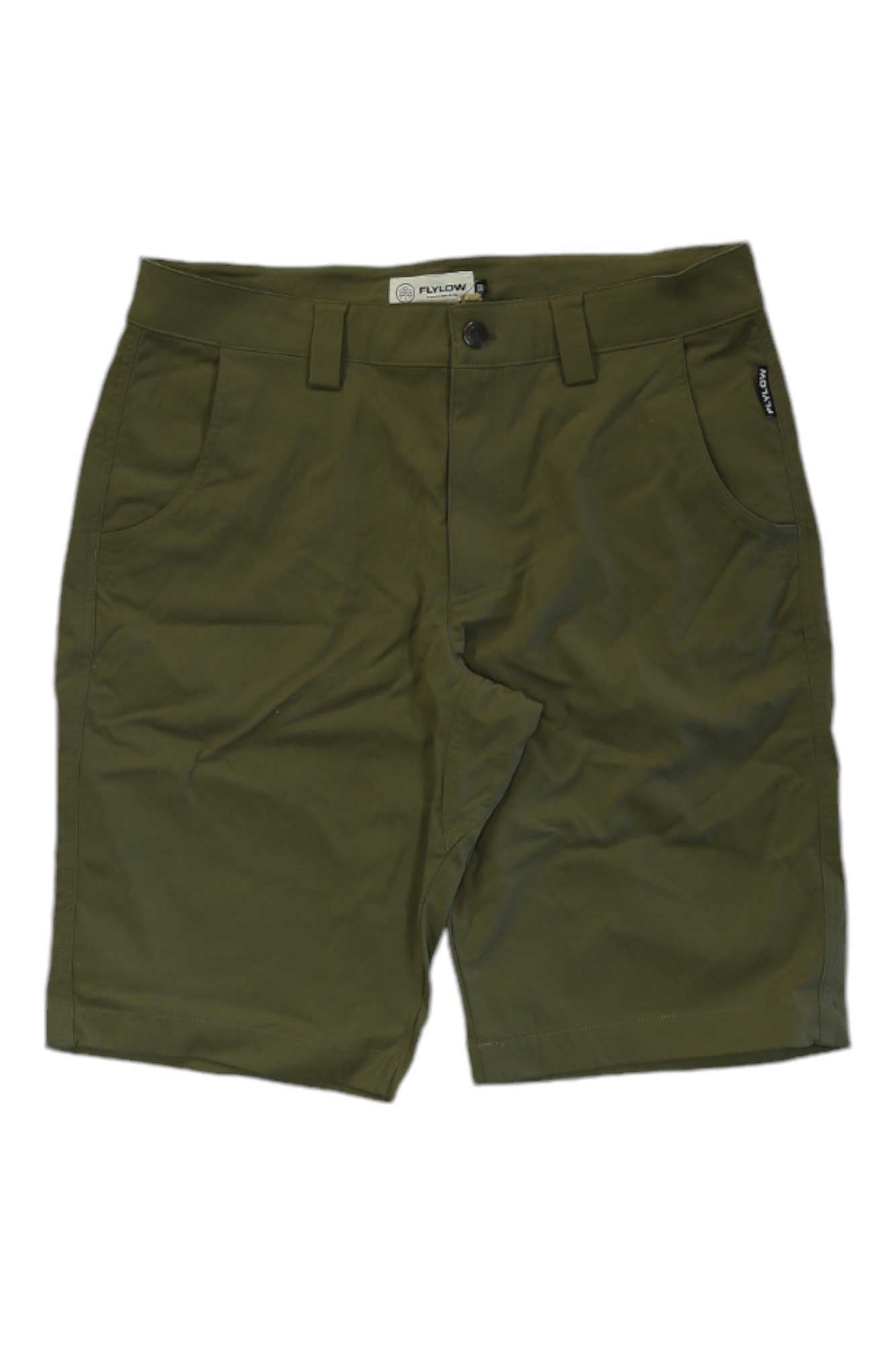 The Flylow Mens Hot Tub 11.5 Inch Short in olive green features belt loops, a front button, side pockets, and a small black tag on the right pocket. Its quick dry fabric makes it perfect for hiking and outdoor adventures, shown on a plain white background.