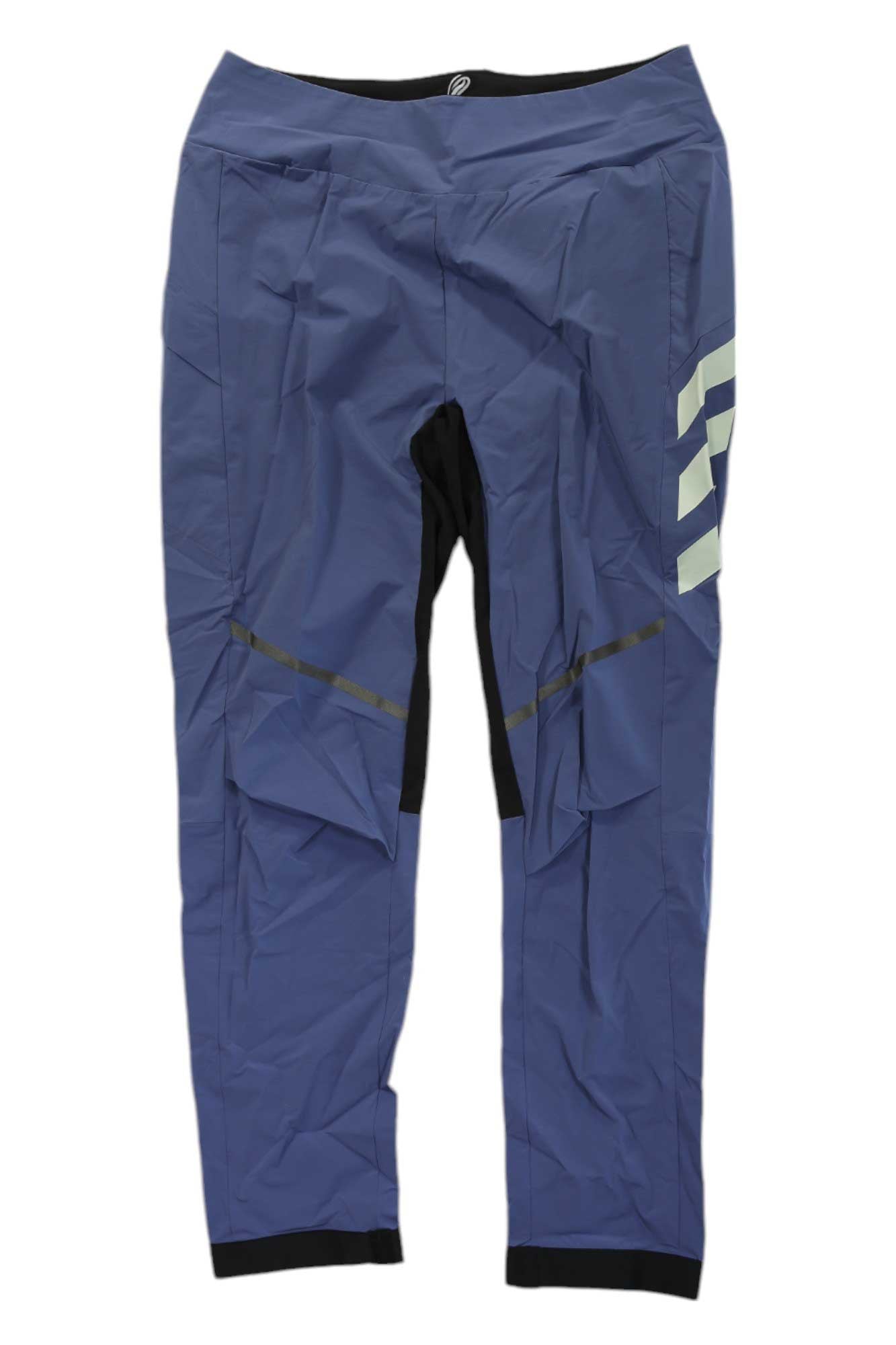 Adidas Women's Terrex Agravic Hybrid Pant in blue, with black and reflective accents and a white geometric design on the left thigh. These athletic trail pants are styled for performance and shown on a plain white background.