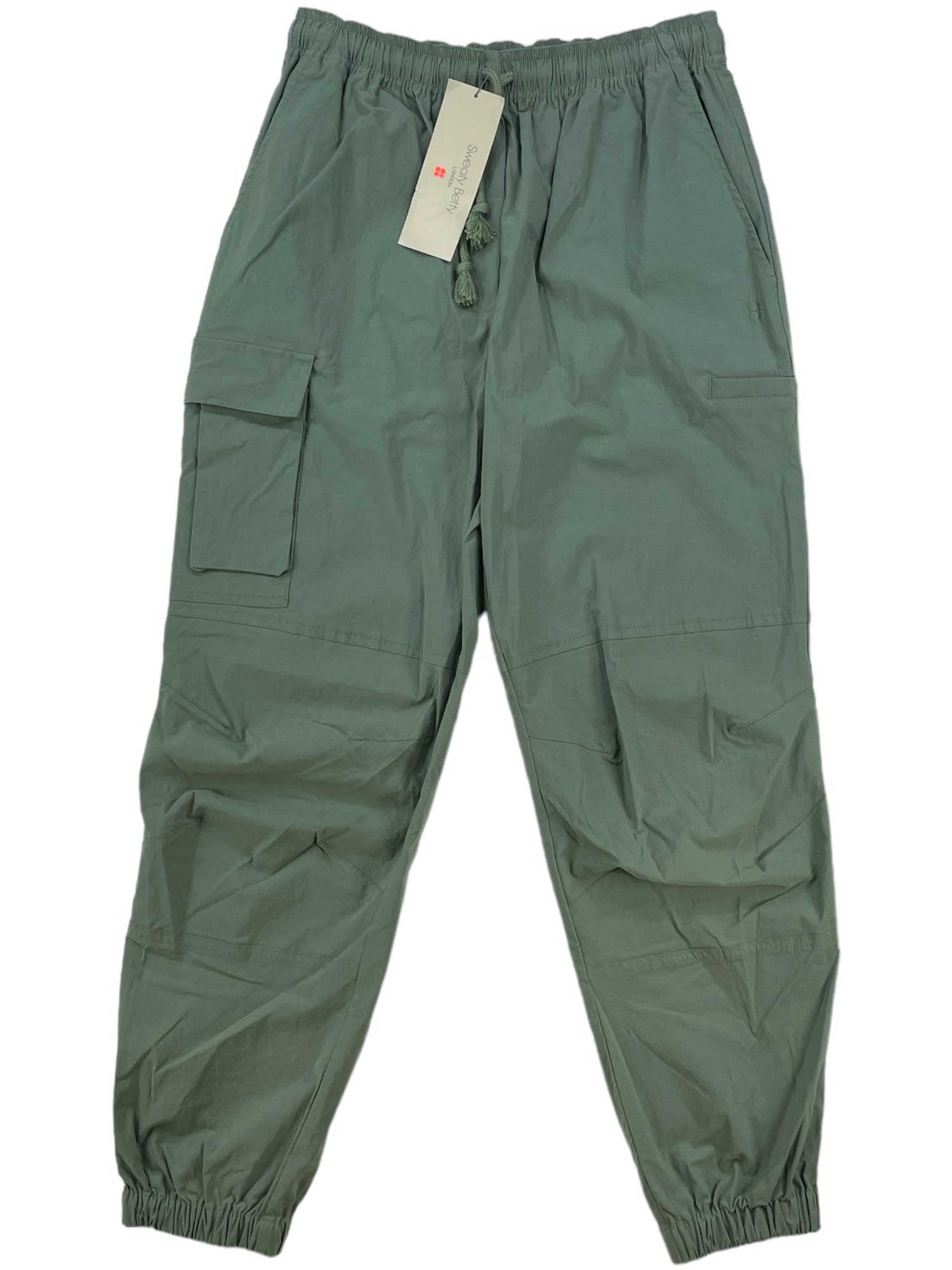 The Sweaty Betty Women's Quinn Cargo Pant features an adjustable elastic waistband with drawstring, elastic cuffs, large side pockets, a slim fit silhouette, and a stylish tag attached to the waistband.
