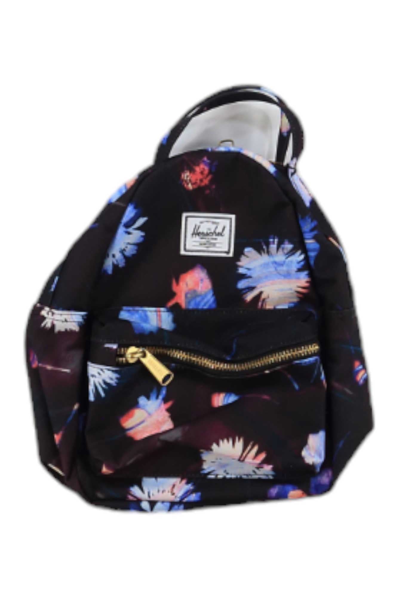 The Herschel Supply Co Nova Mini Backpack is a small black bag featuring a blue and pink floral pattern, gold front pocket zippers, a white rectangular Herschel logo patch on top, and adjustable shoulder straps for comfort.