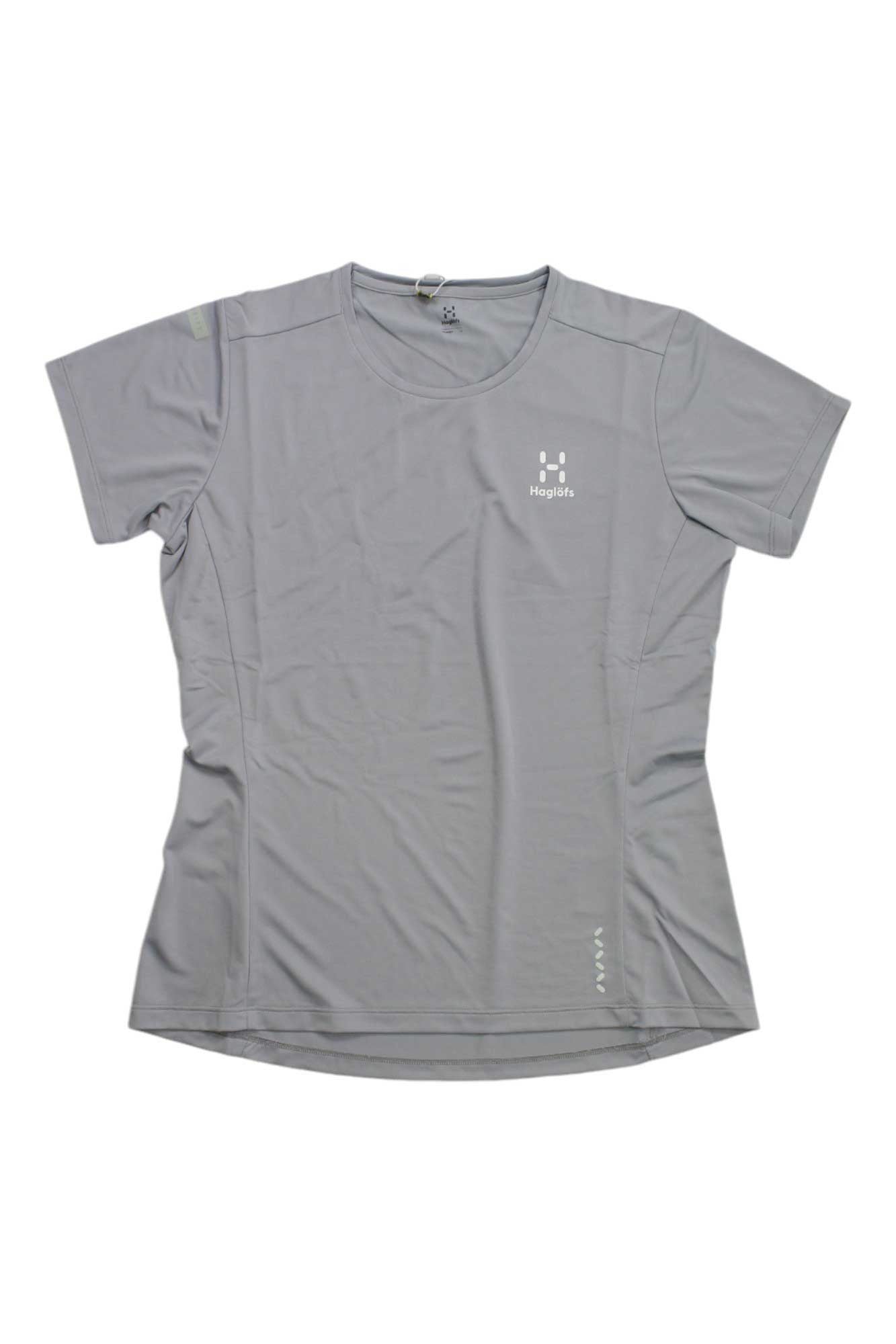 The Haglofs Womens L.I.M Tech Tee is a light gray short-sleeve hiking shirt with a round neckline and small white logo on the left chest. Made from smooth, lightweight recycled polyester with moisture-wicking properties.