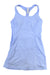 The Sweaty Betty Womens Power Workout Dress in light blue features a sleeveless design with a racerback and built-in bra, displayed flat on a white background.