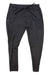 The Rhone Men's Ooo Jogger in black, made with 4-way stretch fabric and equipped with an elastic waistband and drawstring, is displayed flat on a white background.