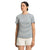 A woman with dark hair pulled back and a neutral expression faces forward in The North Face Womens Best Tee Ever, a slim fit black-and-white striped organic cotton t-shirt, paired with light-colored shorts against a plain white background.