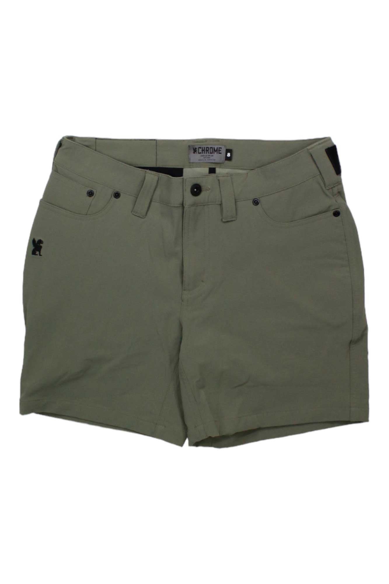 The Chrome Industries Womens Anza Short features olive green, water-resistant fabric, belt loops, front and back pockets, a small black logo on the left thigh, and a black tab on the waistband—ideal for commuter cycling.
