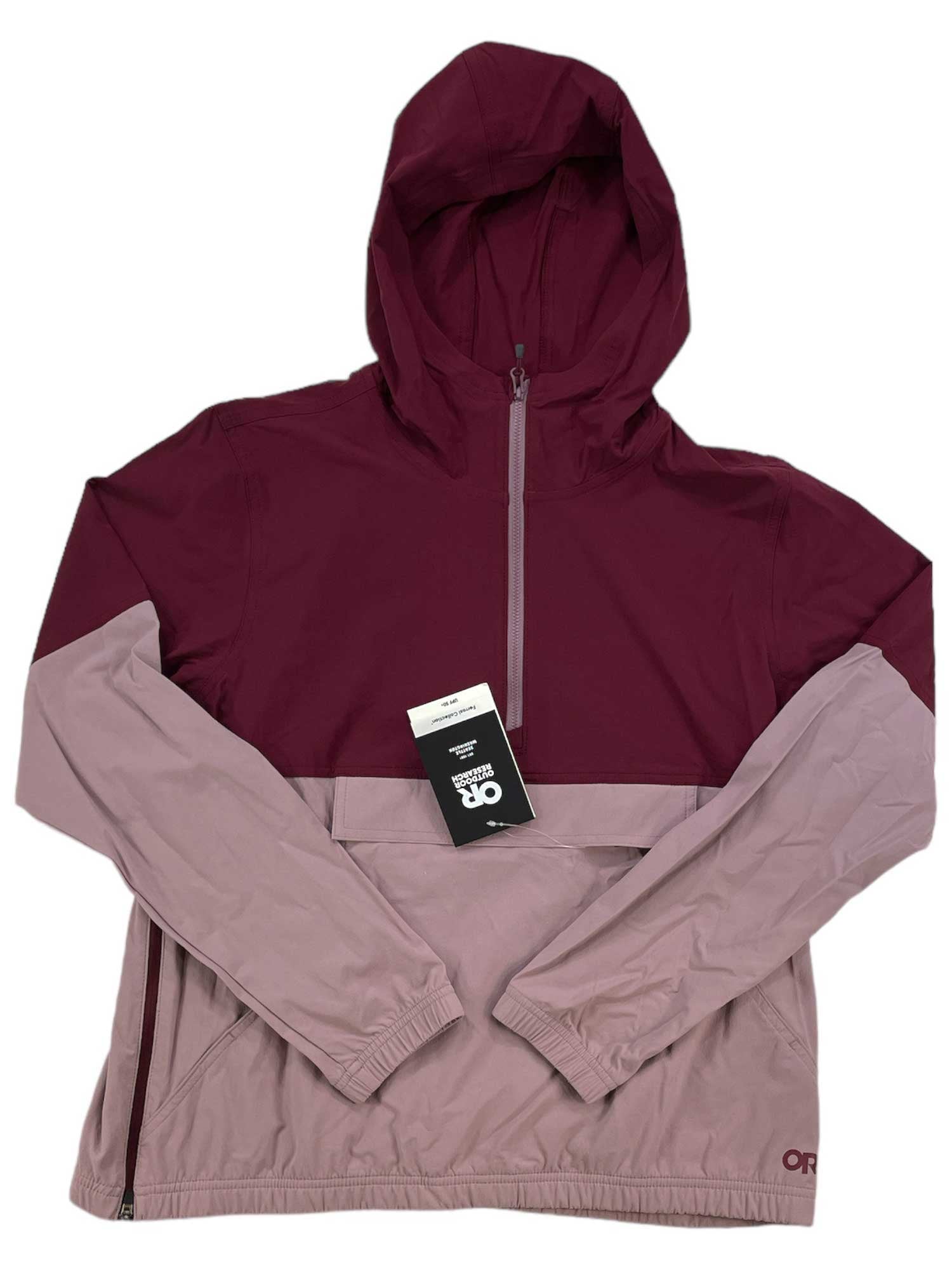 The Outdoor Research Womens Ferrosi Anorak is a lightweight, water-resistant nylon jacket with a two-tone burgundy and light mauve design. It features a half-zip front, elastic cuffs, and an OR logo at the hem for functional style.