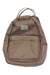 The Herschel Supply Co Nova Mini Backpack is light brown with adjustable shoulder straps, a front zippered pocket, metal zippers, a striped liner, two short top handles, and features a small white rectangular Herschel label.
