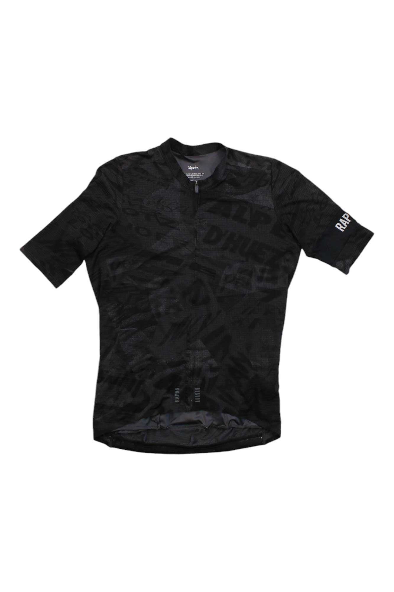 The Pro Team Flyweight Jersey - Road Graffiti is a short-sleeve black road cycling jersey featuring a subtle geometric pattern, breathable fabric, front zipper, and RAPHA branding on the left sleeve.