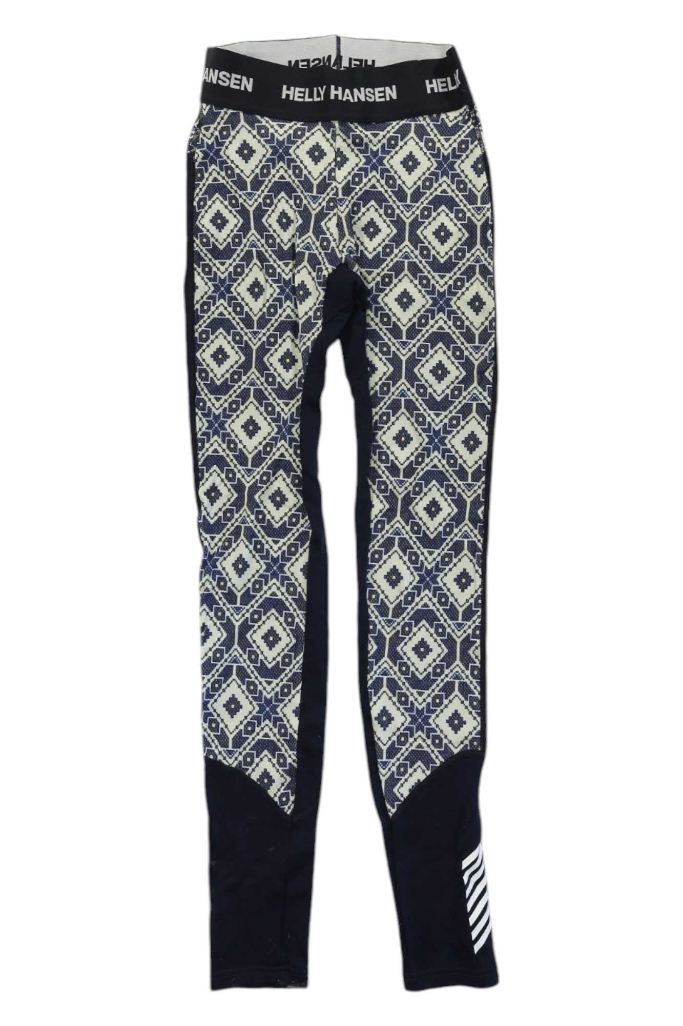 The Helly Hansen Womens Lifa Merino Midweight Graphic Pant features a navy and white geometric pattern, black side and ankle panels, a black waistband with Helly Hansen in white text, and moisture-wicking fabric for comfort.