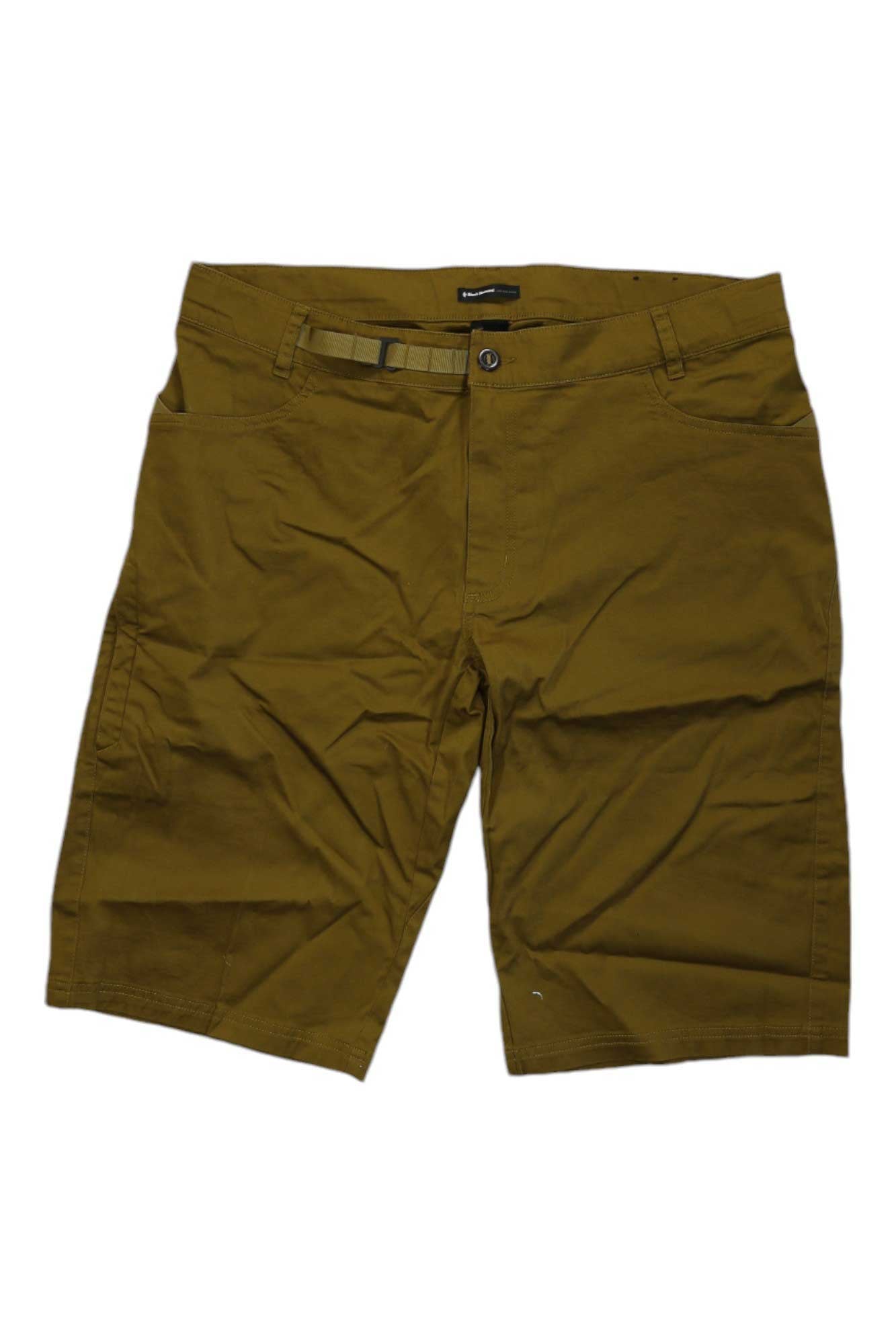 The Black Diamond Mens Credo Short is a pair of knee-length, brown climbing shorts made from organic cotton with belt loops, an adjustable waistbelt, front pockets, and a button-zip closure, shown on a white background.