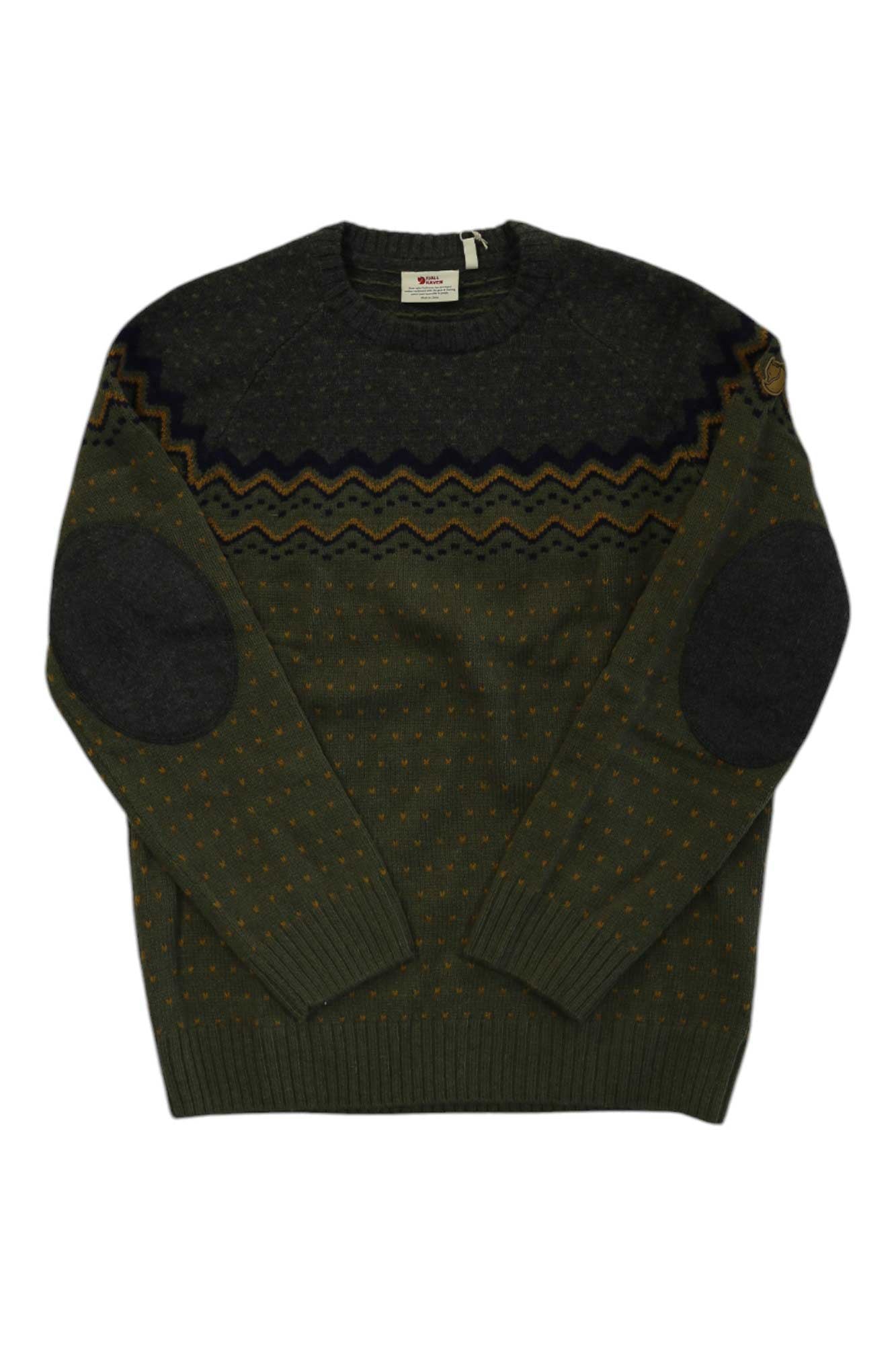 The Fjallraven Mens Ovik Knit Sweater in olive green features a geometric zigzag chest pattern, dotted accents, and dark oval elbow patches on both sleeves, shown flat against a white background.