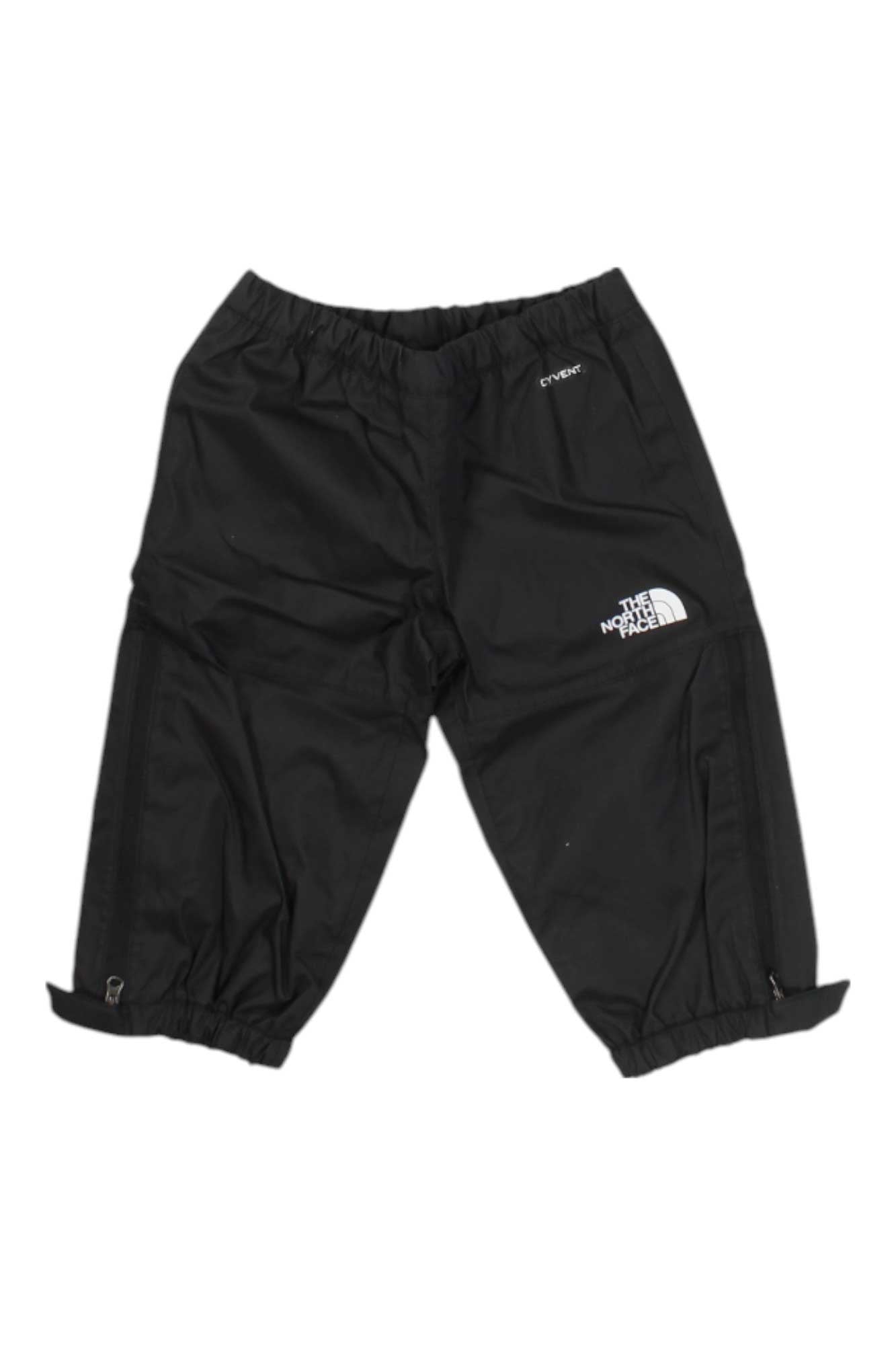 The North Face Toddlers Antora Rain Pant, black with an elastic waist and hems, features The North Face logo on one thigh and HyVent text near the pocket—ideal waterproof rain pants for toddlers.