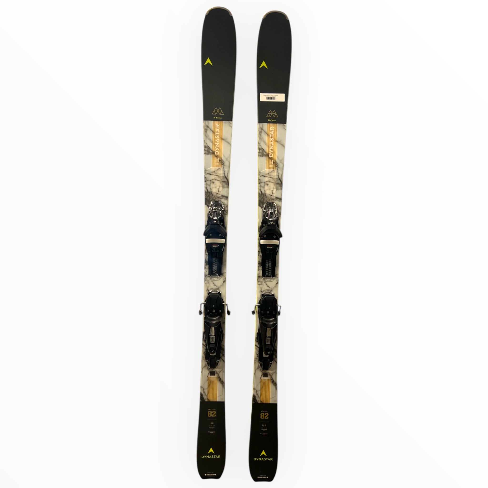 Skis with bindings, tan graphic with black tips and yellow accents