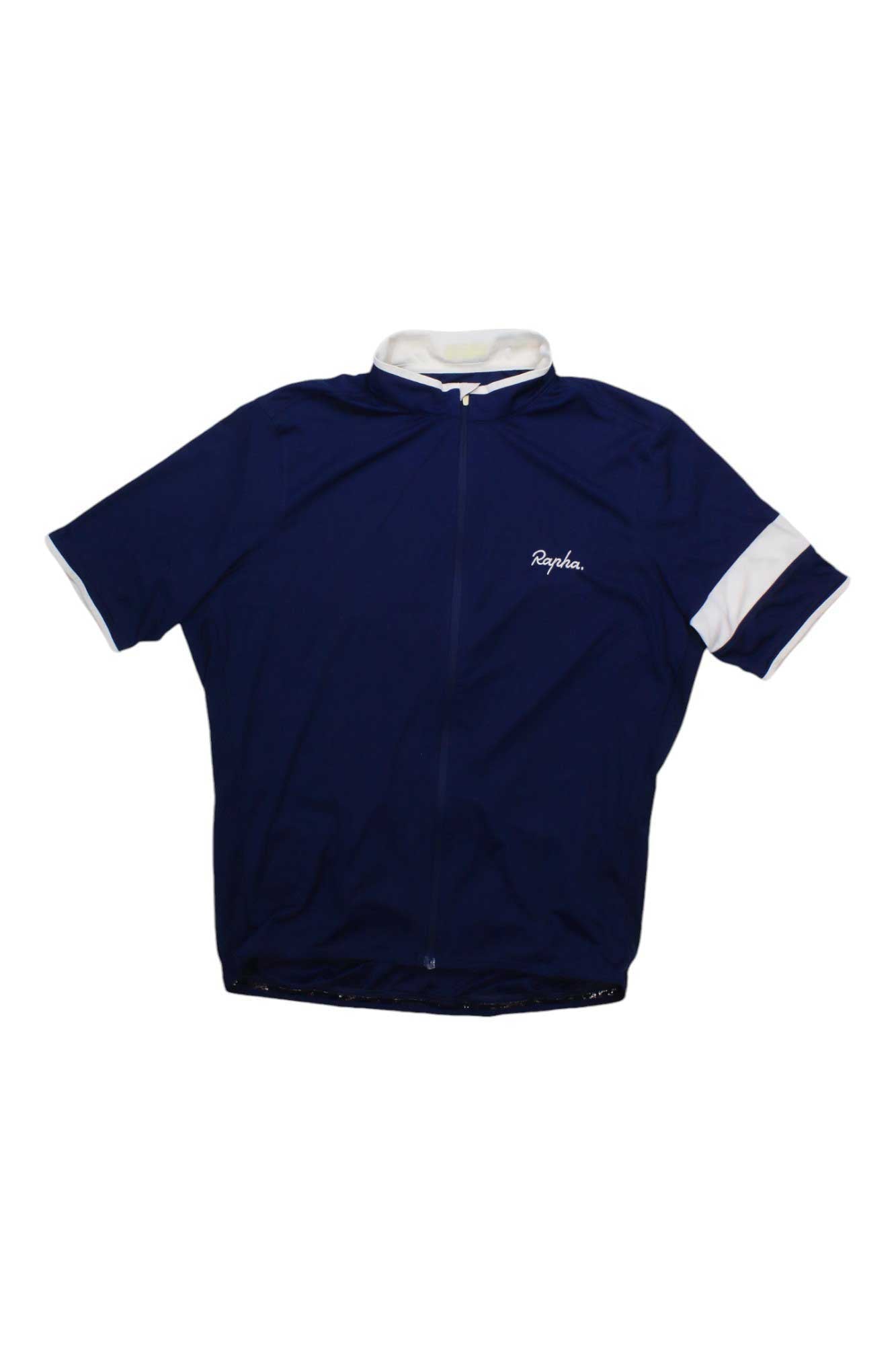 The Rapha Men's Super Lightweight Jersey is a short-sleeved navy blue cycling top with a white collar, white sleeve stripe, and front zipper. "Rapha" is printed in white on the left chest.