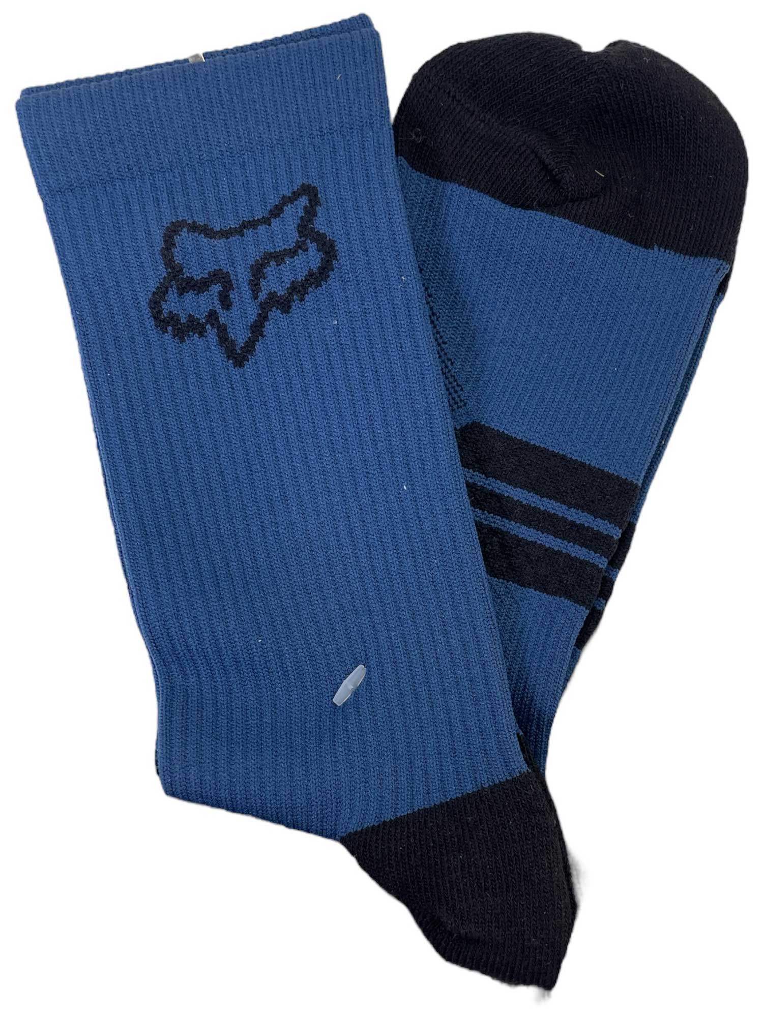 The Fox 6 Inch Ranger Sock is a pair of blue and black crew socks—one has a fox head logo, the other two black toe stripes—with compression arch support, ideal for mountain biking.