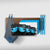 The Cyan Bundle Maple Board, mounted on a wall as part of a garage storage system, is shown with two gray and blue towels, a blue and white box, and three blue adjustable straps hanging beside it.