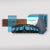 The Cyan Bundle Maple Board kit is displayed with four black and blue wall mounts, a maple board panel, four blue straps, a cyan box, and three gray towels on a light gray background.