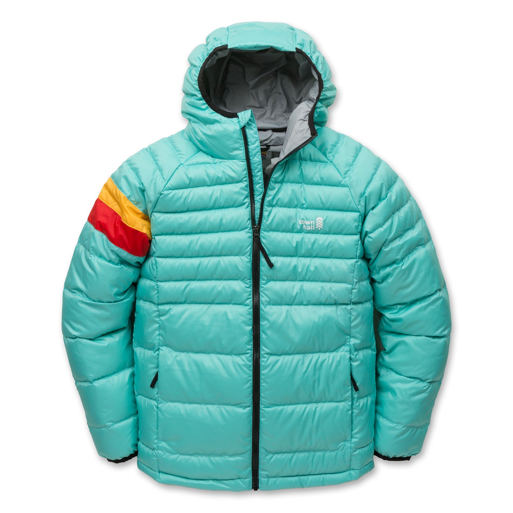 The Down Town Kids Puffy is a teal hooded puffer jacket with a front zipper, two zippered pockets, and recycled down insulation. The left sleeve has red, orange, and yellow stripes; brand logo on the left chest. Sustainable winter coat.
