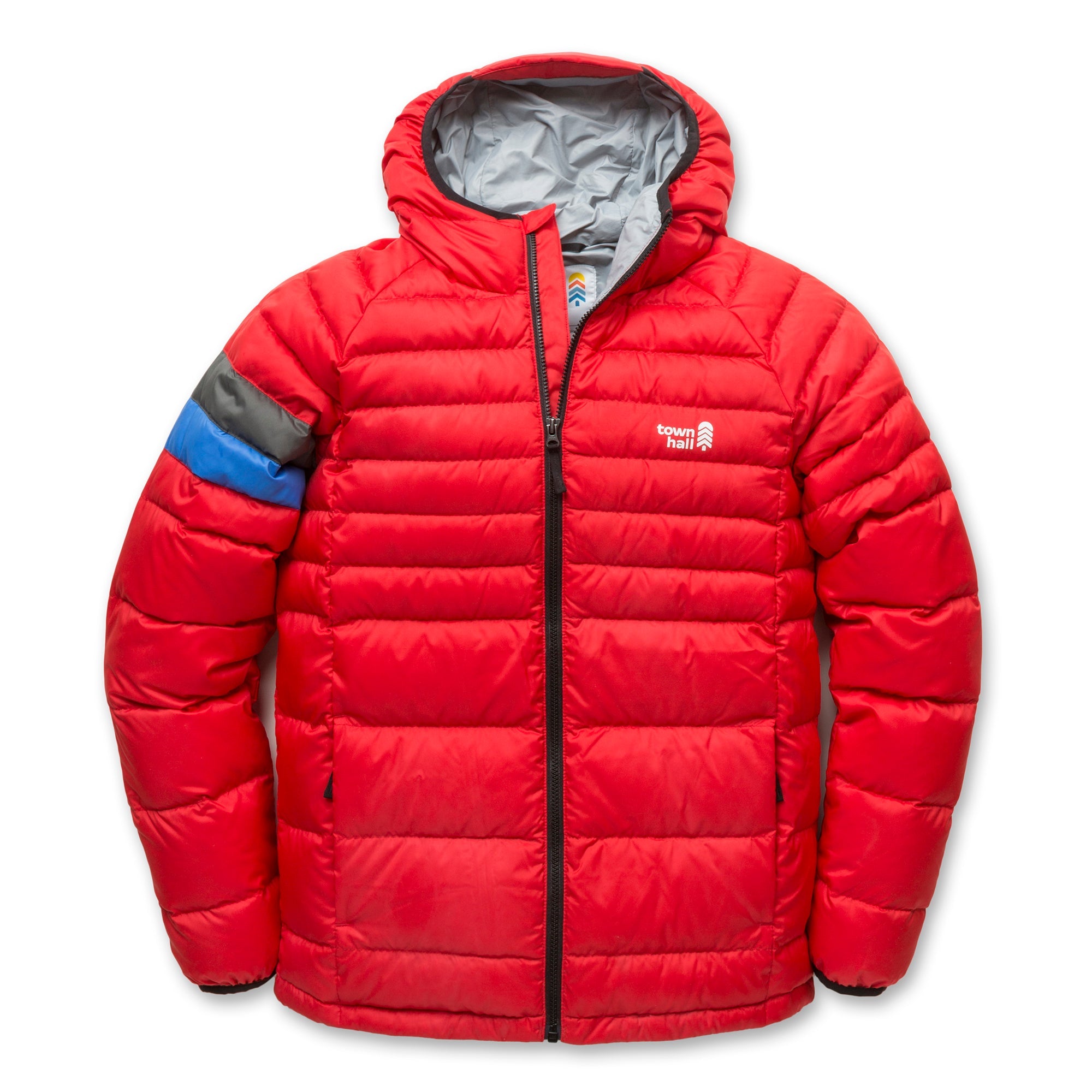 The Down Town Kids Puffy is a red hooded puffer jacket with gray lining, blue and gray accent on the left sleeve, recycled down insulation, front zipper, and Town Hall logo on the left chest.
