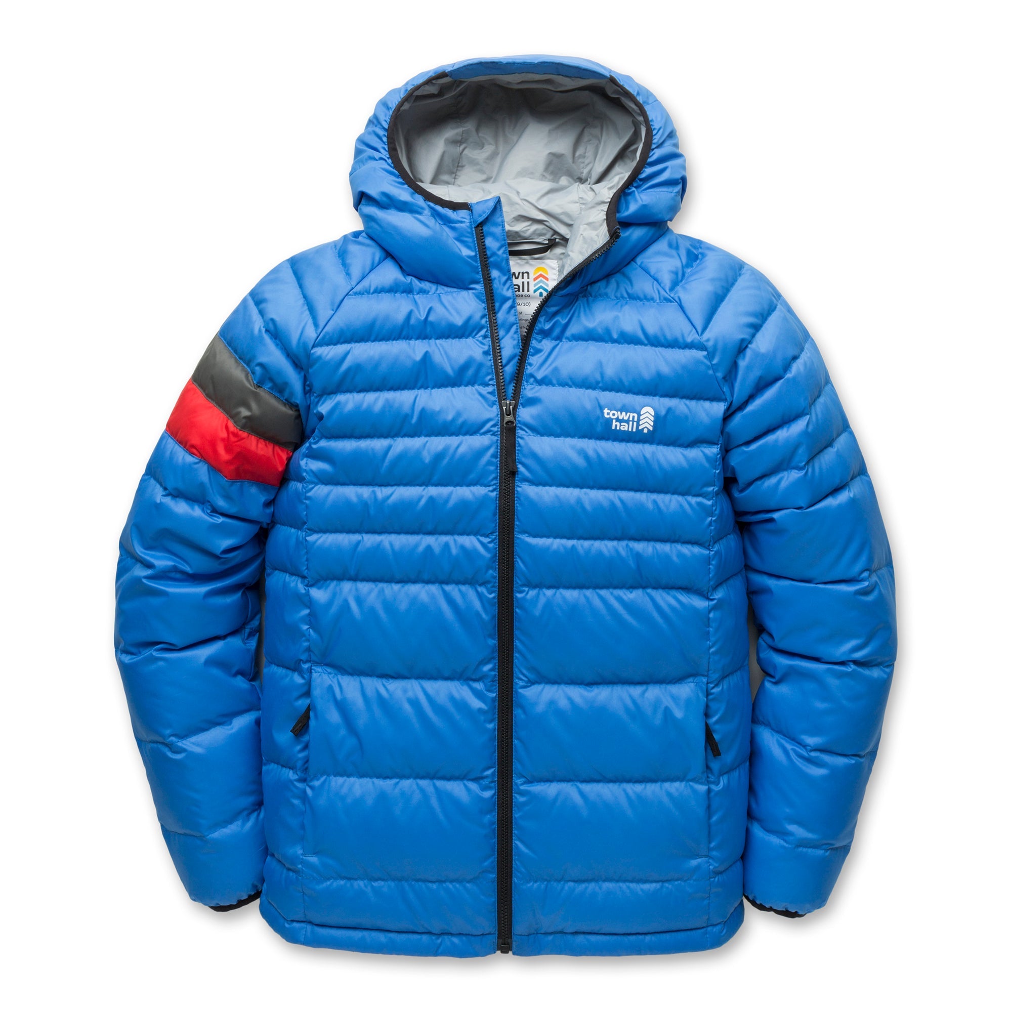 The Down Town Kids Puffy is a blue hooded puffer jacket with black zipper, two front pockets, red and gray striped left sleeve, and Mount Trail logo on the chest. Made with recycled down insulation for sustainable warmth.