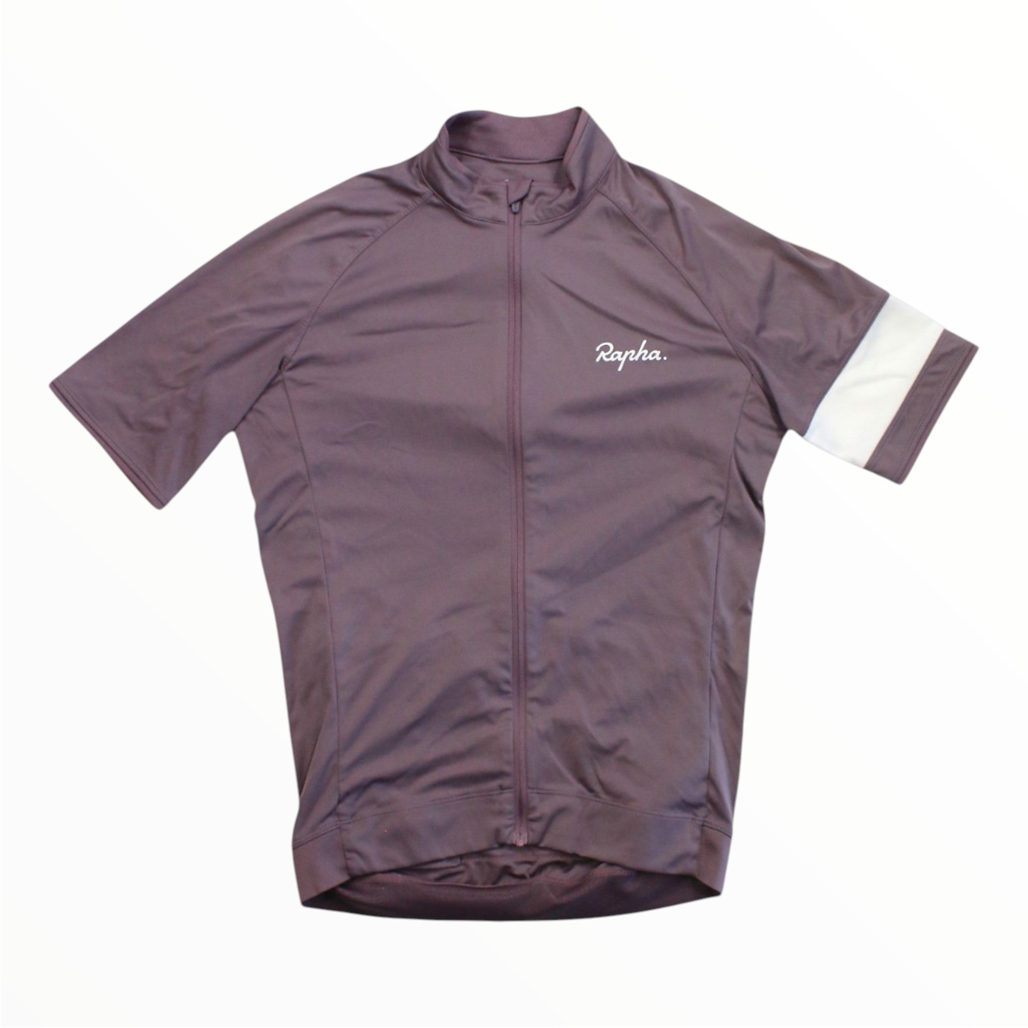 A mauve Rapha Mens Core Jersey, featuring short sleeves, a front zipper, a white stripe on the left sleeve, and the Rapha logo on the chest. Ideal for men’s cycling apparel collections, this jersey by Rapha is shown laid flat on a white background.
