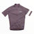 A mauve Rapha Mens Core Jersey, featuring short sleeves, a front zipper, a white stripe on the left sleeve, and the Rapha logo on the chest. Ideal for men’s cycling apparel collections, this jersey by Rapha is shown laid flat on a white background.