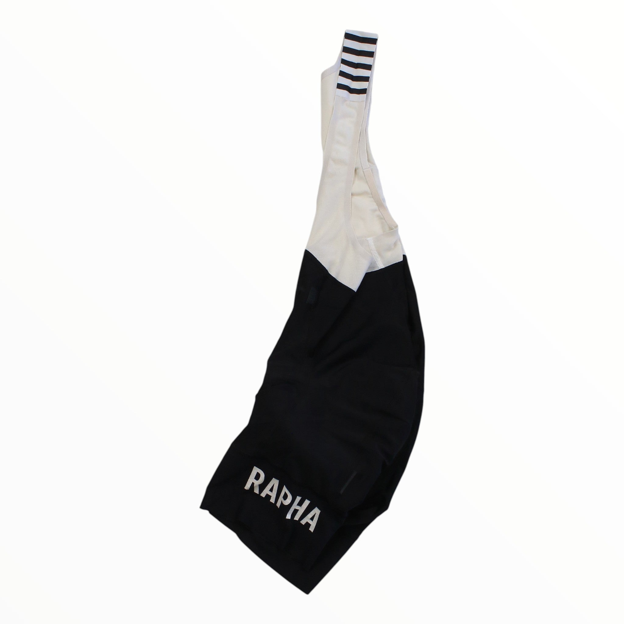 Rapha Pro Team bib shorts with black lower panel, white upper, striped cuffs, RAPHA print