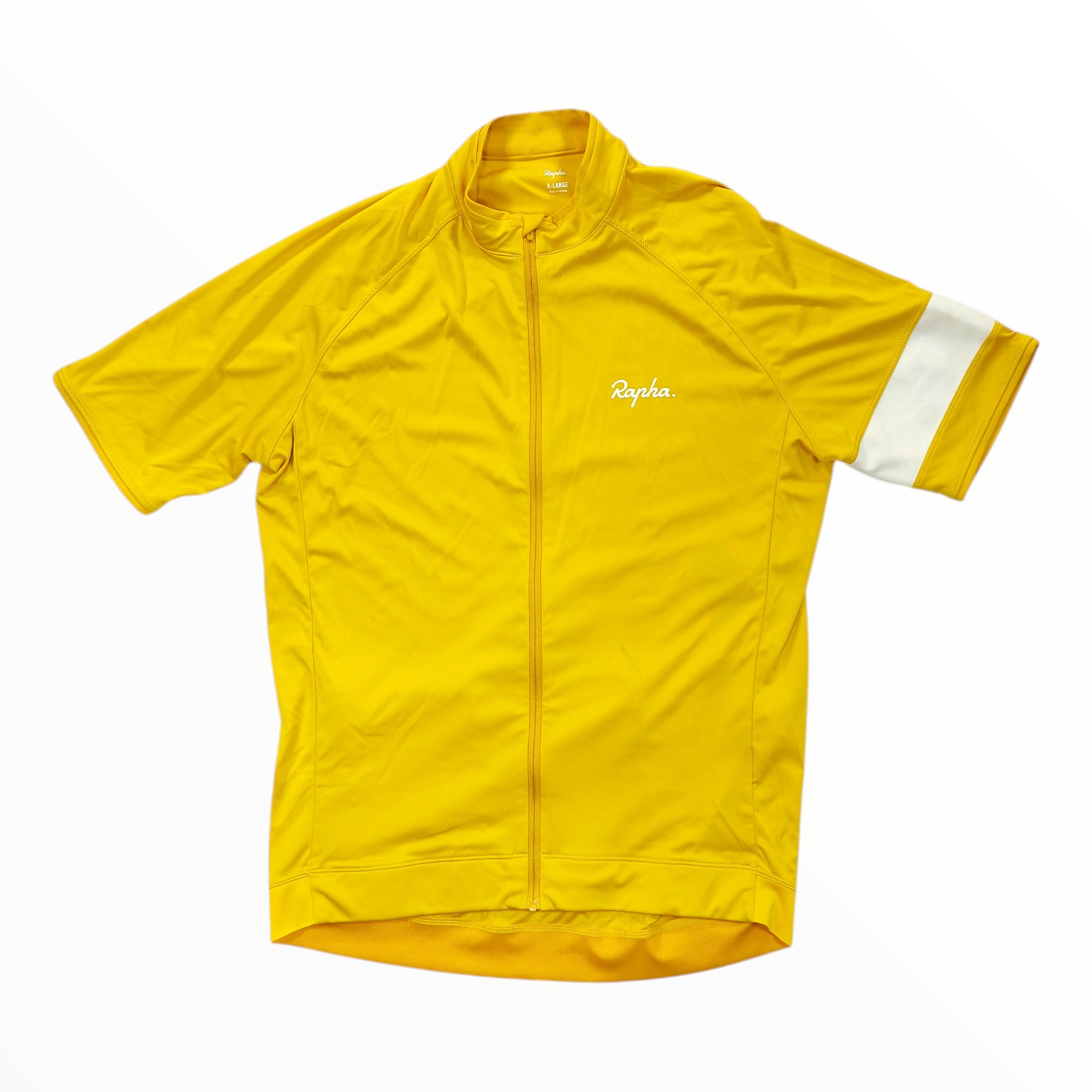 The Rapha Mens Core Jersey is a vibrant yellow short-sleeve cycling jersey featuring a front zipper, a white Rapha logo on the chest, and a distinctive single white stripe on the left sleeve—ideal for those in search of premium men’s cycling apparel.