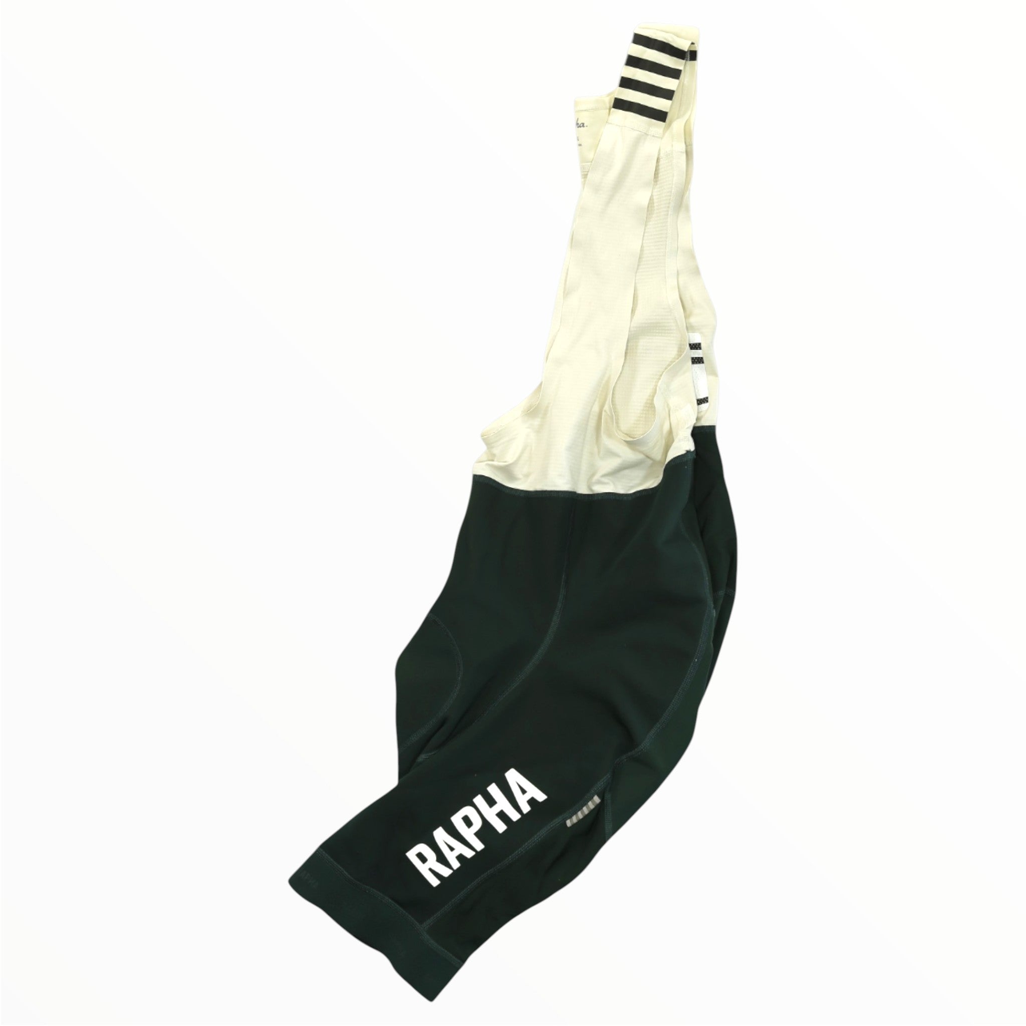 The Rapha Mens Pro Team Winter Bib Shorts feature a dark green lower section with white RAPHA logo, cream straps with black stripes, and are shown on a white background—perfect men's cycling apparel for cold weather rides.