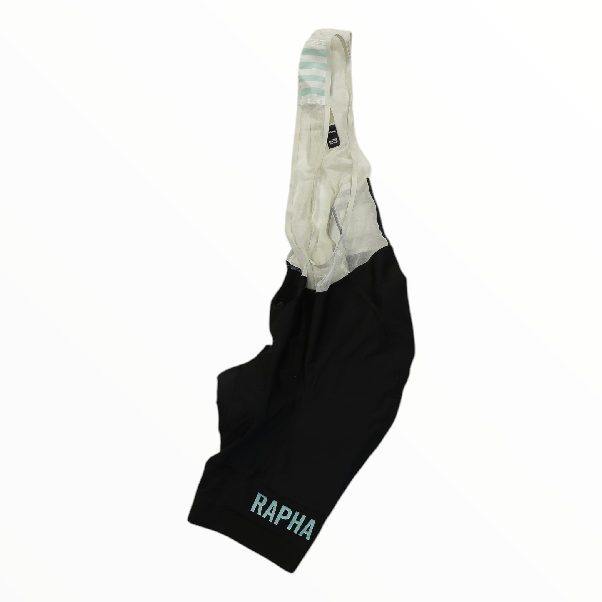 Rapha Pro Team bib shorts with cream upper, black lower, striped cuff, RAPHA logo on leg