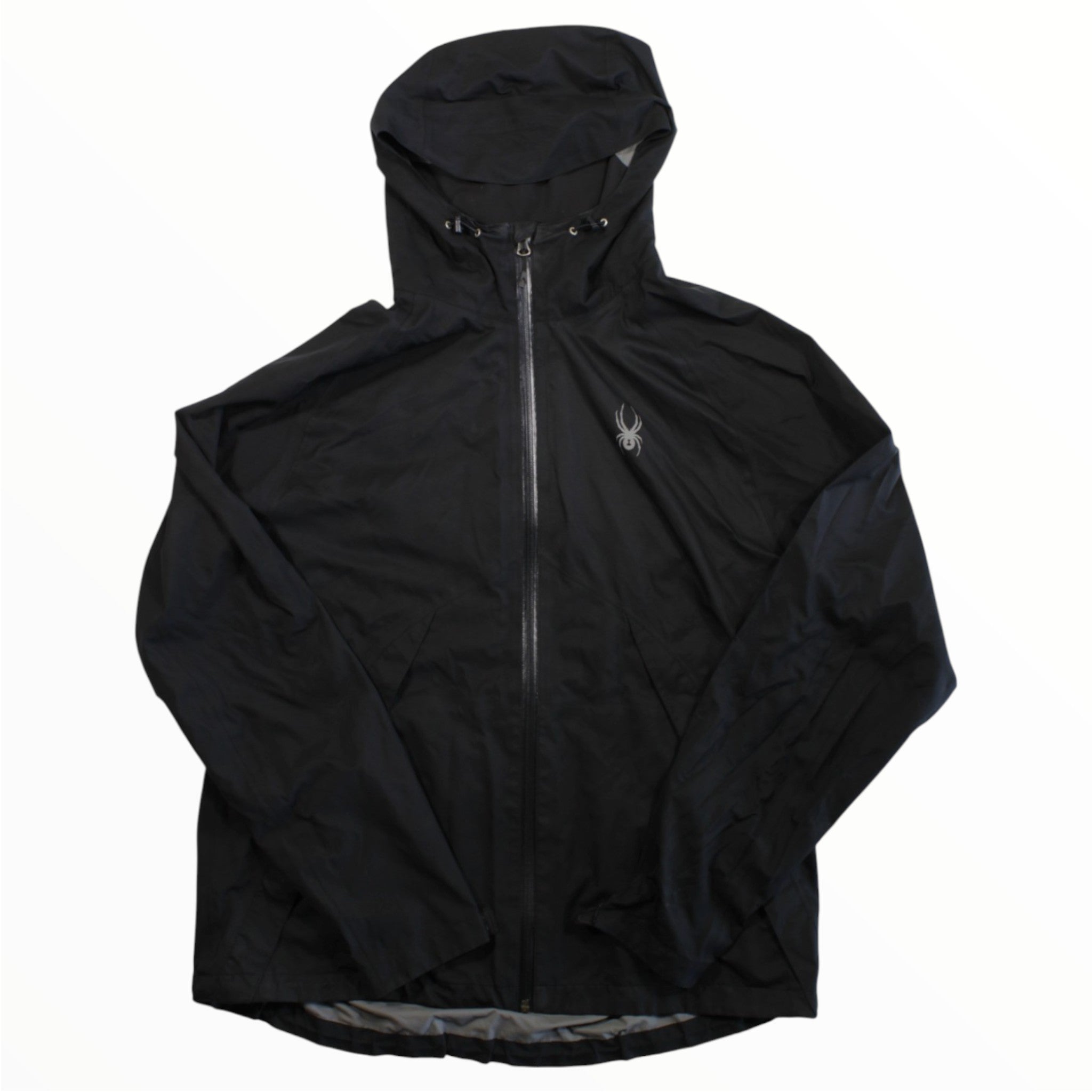 The Spyder Mens Pryme Shell Jacket is a lightweight black hooded jacket featuring a front zipper, hood drawstrings, and a small silver spider logo on the left chest, shown against a plain white background.