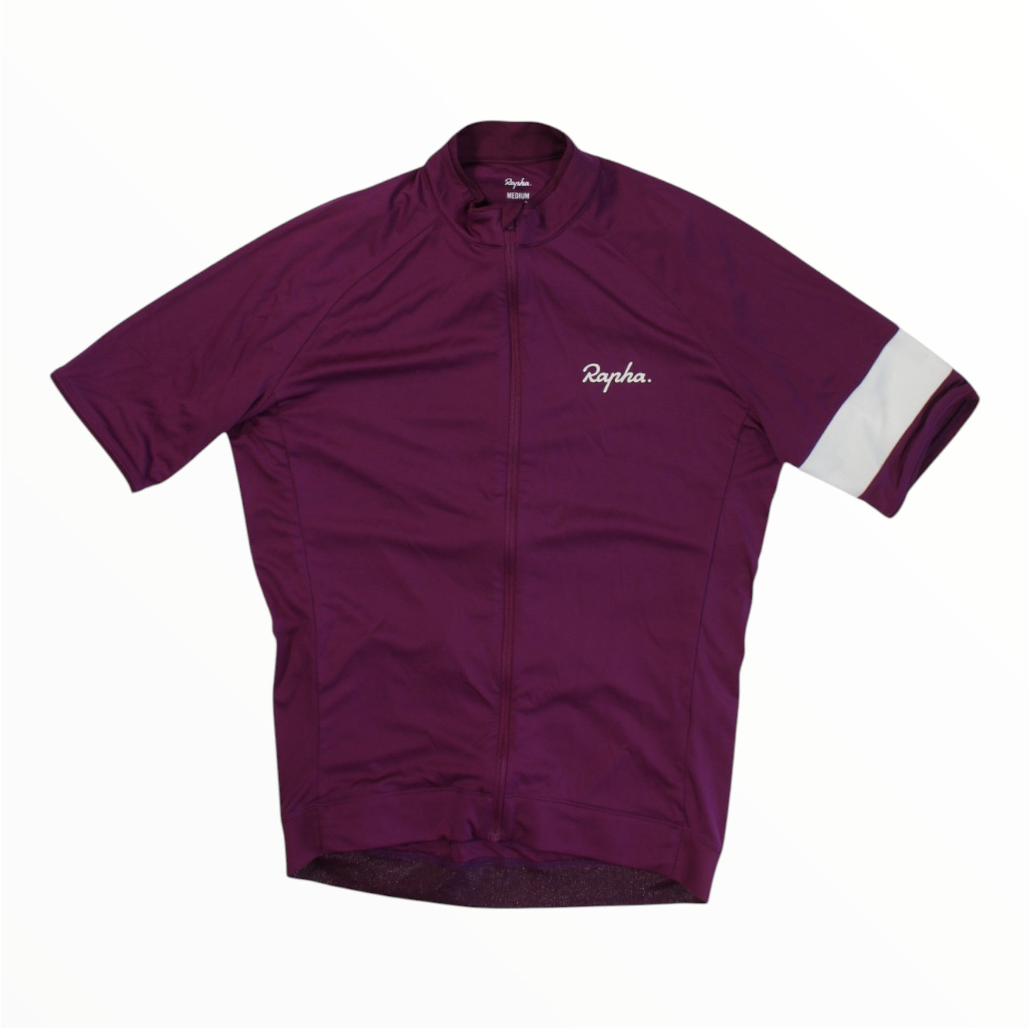 The Rapha Mens Core Jersey by Rapha is a purple cycling jersey featuring short sleeves, a convenient front zipper, the signature white Rapha logo on the chest, and a distinctive white stripe on the left sleeve—making it an essential piece in men’s cycling apparel.