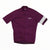 The Rapha Mens Core Jersey by Rapha is a purple cycling jersey featuring short sleeves, a convenient front zipper, the signature white Rapha logo on the chest, and a distinctive white stripe on the left sleeve—making it an essential piece in men’s cycling apparel.