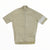 The Rapha Mens Core Jersey by Rapha is a beige, short-sleeve cycling jersey featuring a front zipper and a distinctive white stripe on the left sleeve, shown laid flat against a white background—making it a standout in men’s cycling apparel.