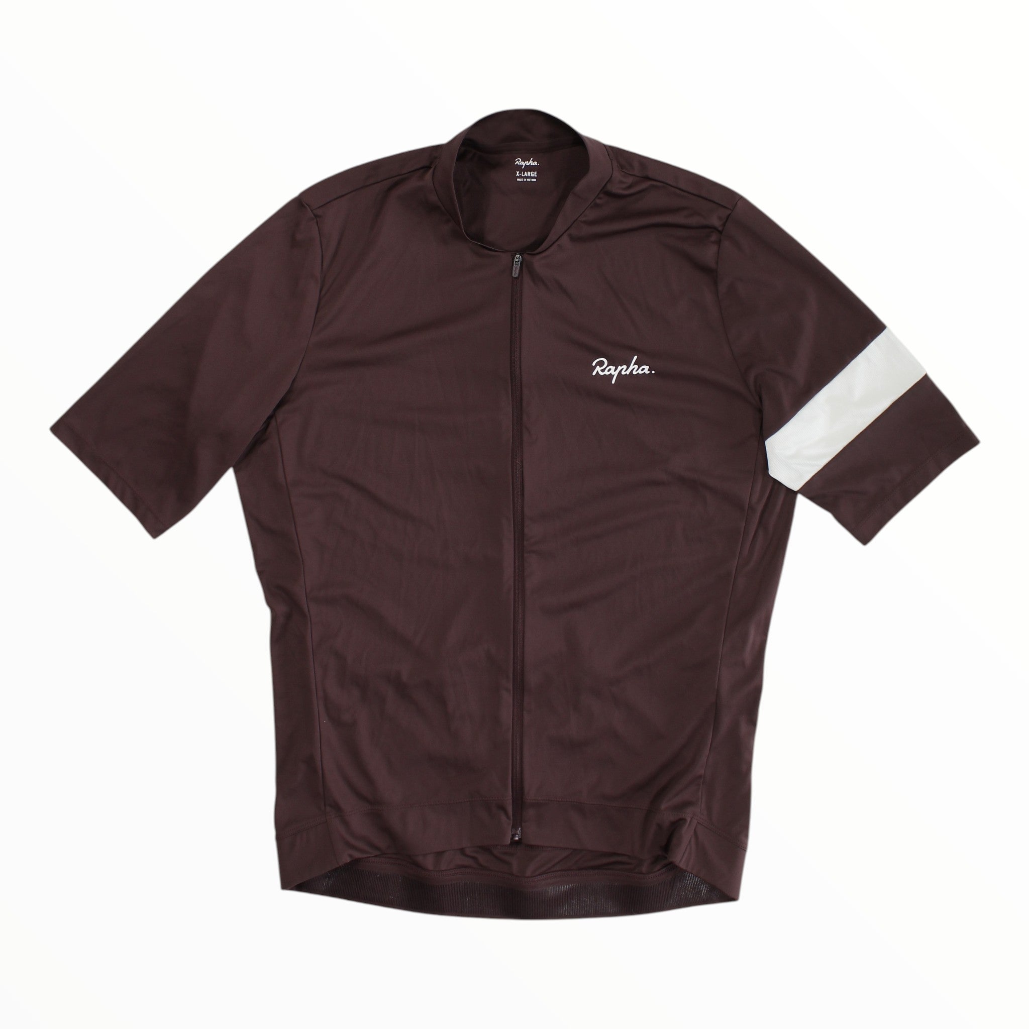 A maroon Rapha Mens Core Jersey featuring short sleeves, a full-length front zipper, a white Rapha logo on the left chest, and a single white stripe on the left sleeve is laid flat against a white background—an eye-catching offering from Rapha’s men’s cycling apparel range.