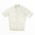 An off-white Rapha Mens Core Jersey with short sleeves, a high collar, and a full-length front zipper is displayed flat against a white background—a timeless piece from Rapha’s collection of men’s cycling apparel.