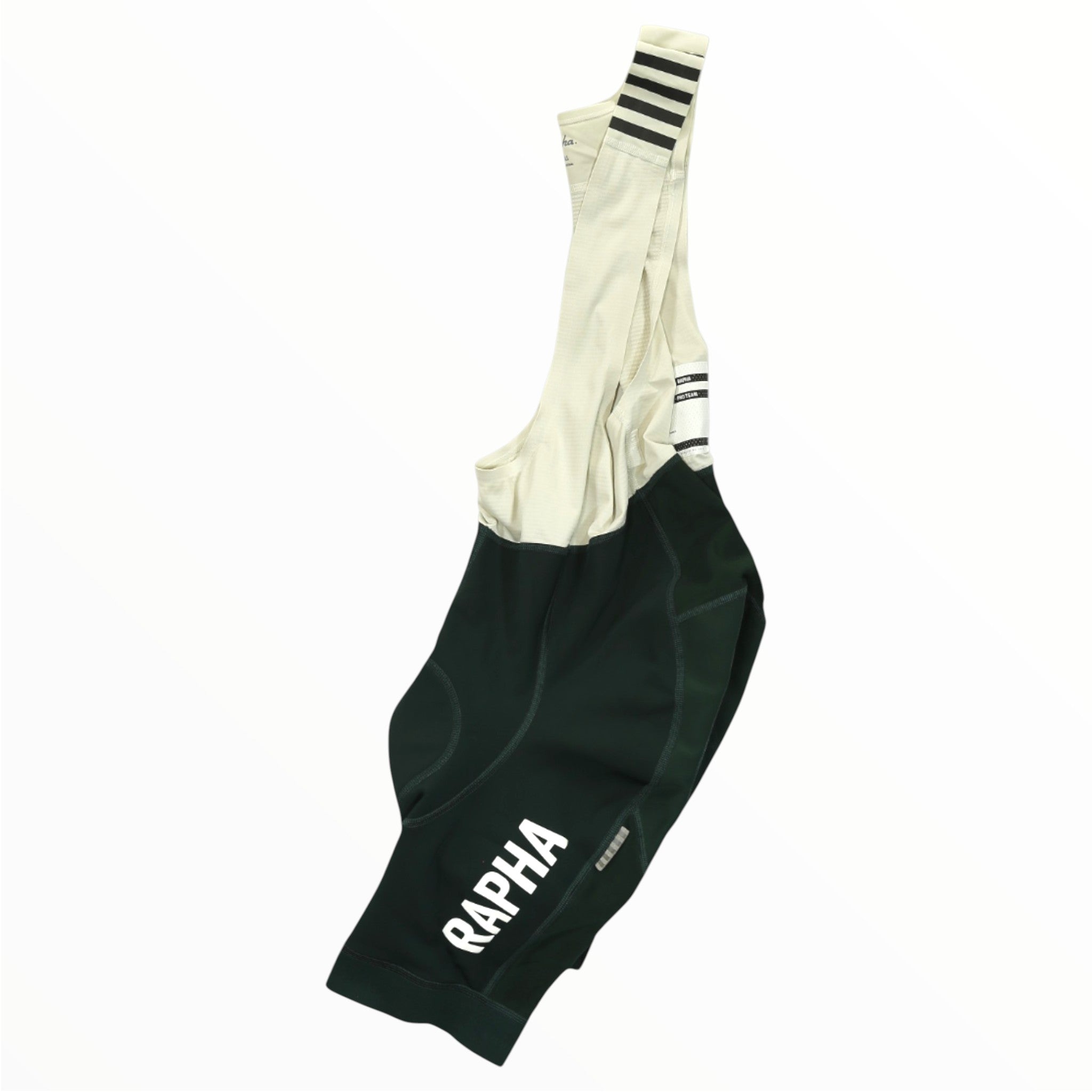 Rapha Mens Pro Team Winter Bib Shorts in black and white with shoulder straps feature RAPHA branding in white on the leg and black stripes on the white straps, shown on a plain white background. Premium men's cycling apparel.