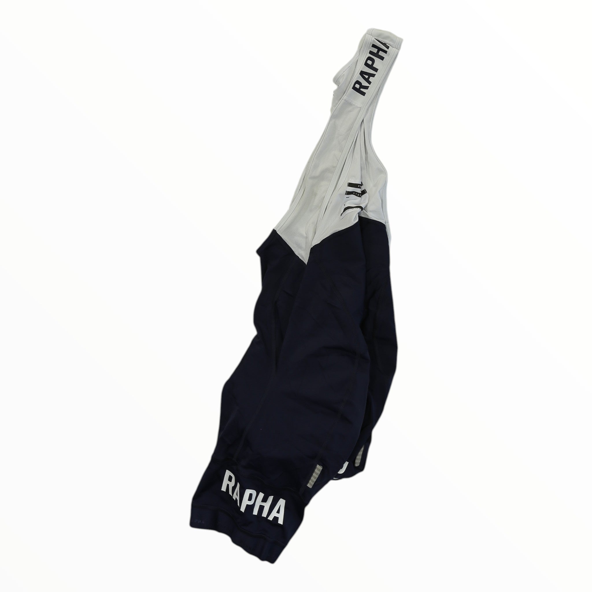 Rapha Pro Team bib shorts with light gray upper, dark navy lower, striped cuff, RAPHA logo