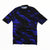 A Rapha Mens Core Jersey is displayed laid flat on a white background, showcasing its short sleeves, black base, and striking blue geometric pattern. Designed by Rapha for comfort and performance, this men’s cycling jersey features a front zipper and collar, exemplifying stylish cycling apparel.