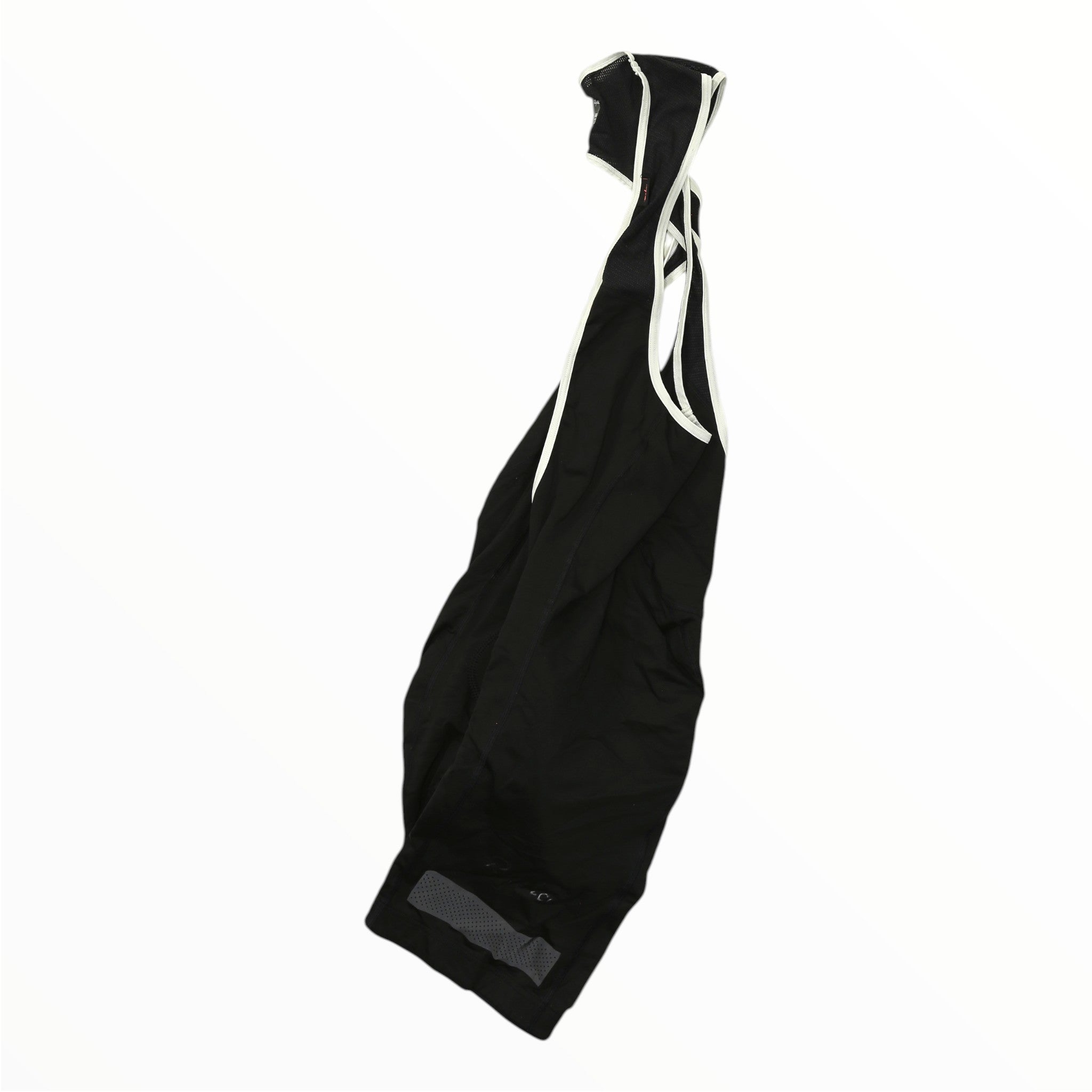 Black cycling bib shorts with white contrast trim and reflective leg patch detail